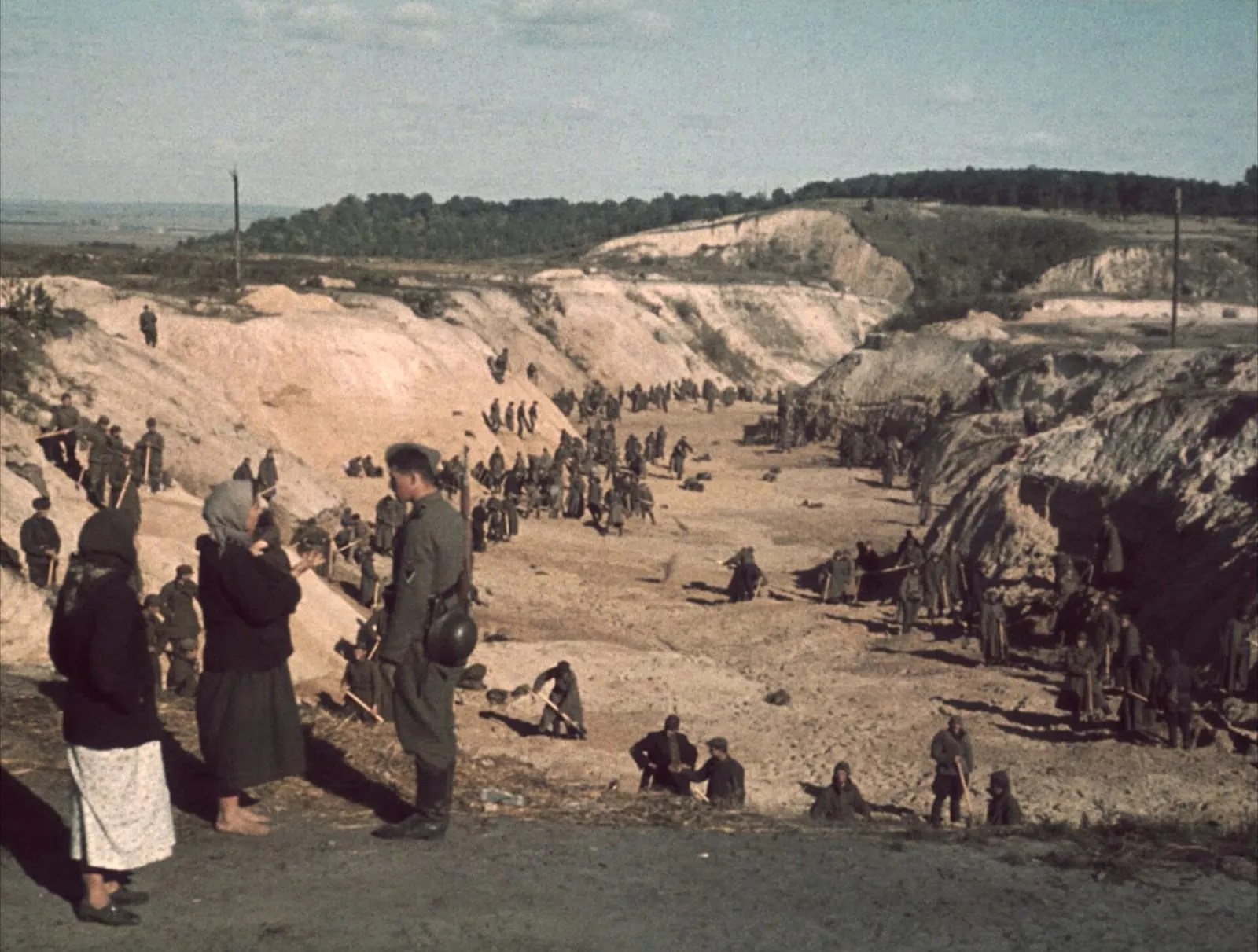 Soviet prisoners of war covering a mass grave after the Babi Yar massacre, 1 October 1941.