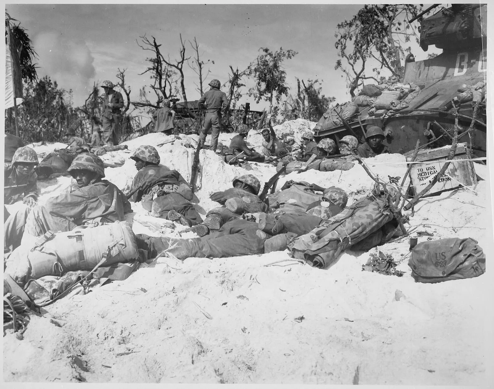 Marines moving through trenches on the beach during the Peleliu landing, 15 September 1944.