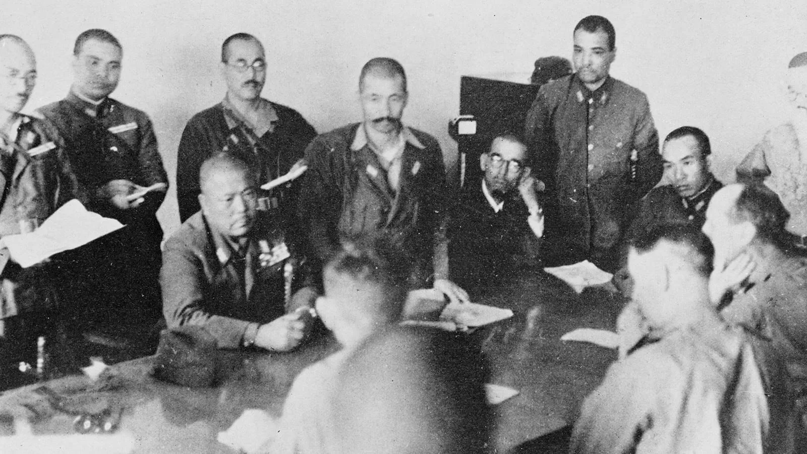 The surrender negotiations at Singapore, 15 February 1942: Yamashita thumps the table to stress his terms, with General Percival opposite.