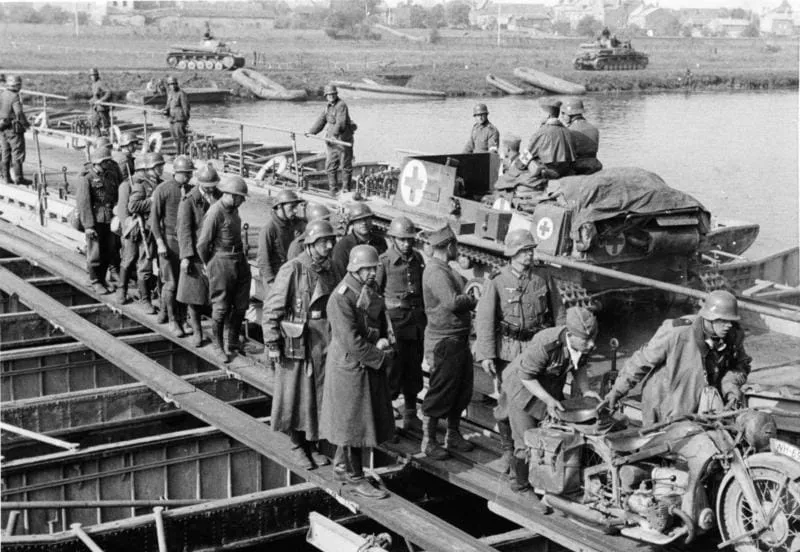 The German 1st Panzer Regiment crosses a pontoon bridge over the Meuse at Floing near Sedan, 14 May 1940.