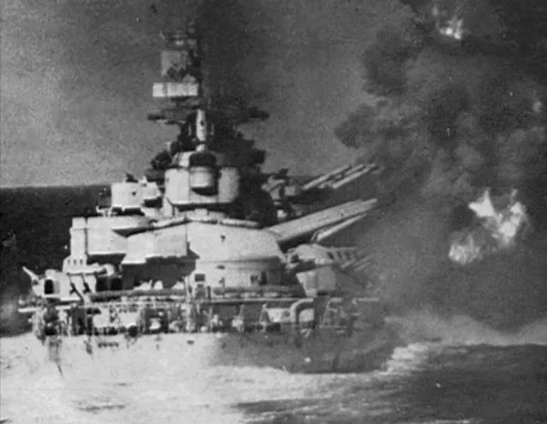 The Italian battleship Vittorio Veneto firing on British cruisers near Gavdos, on the afternoon before the Battle of Cape Matapan.