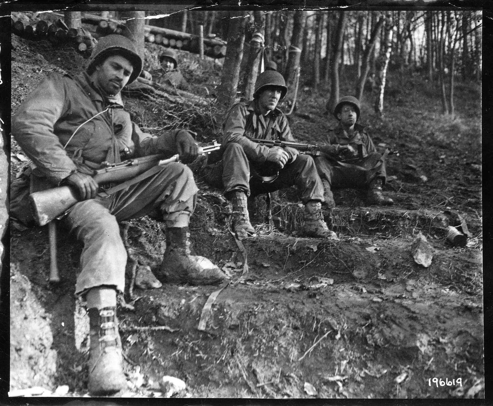 Weary infantrymen of the US 4th Infantry Division rest in the Düren area, 18 November 1944.