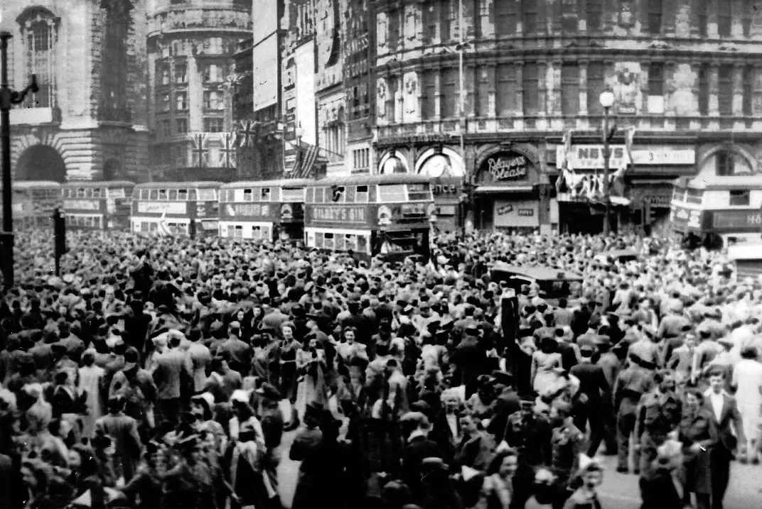 Crowds celebrating VE Day at Piccadilly Circus, London, 8 May 1945.