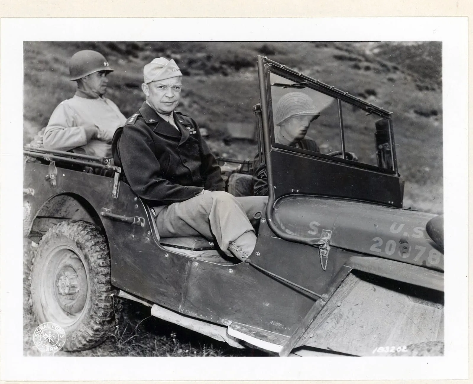 General Dwight Eisenhower and General Omar Bradley touring the Tunisian front by jeep in 1943.