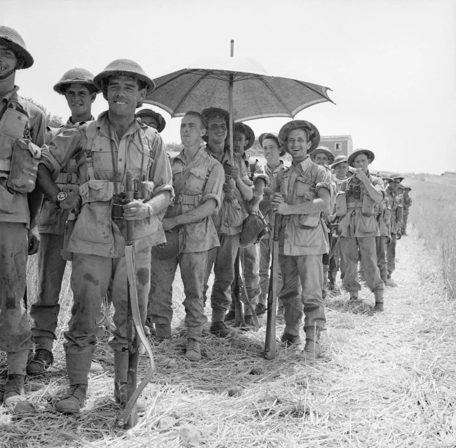 Men of the 6th Battalion, Royal Inniskilling Fusiliers, 78th Division, await orders to move into Centuripe, Sicily, 2 August 1943.
