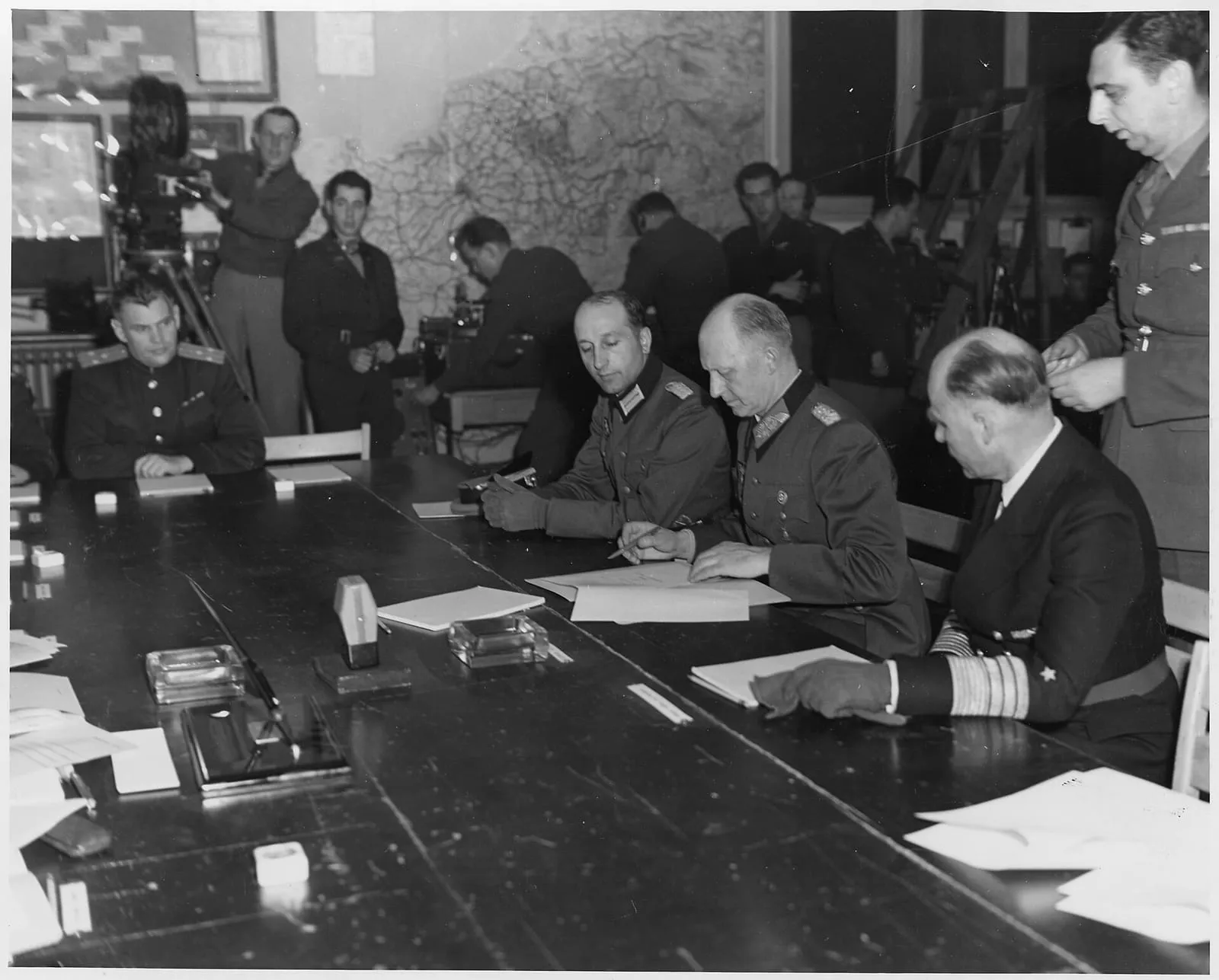 General Alfred Jodl signs the German instrument of surrender at Reims, 7 May 1945.