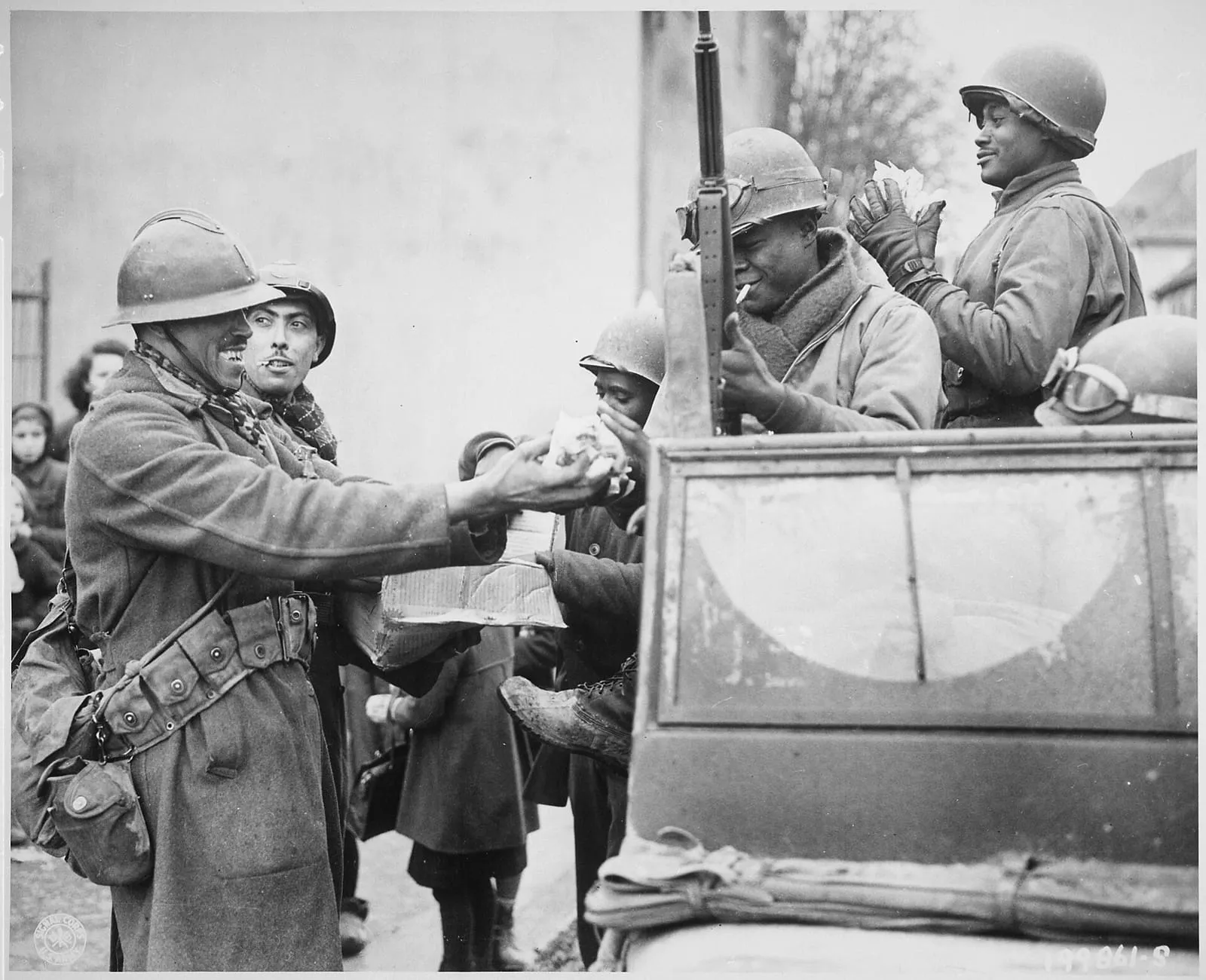Moroccan French soldiers and an American soldier during the reduction of the Colmar Pocket, 5 February 1945.