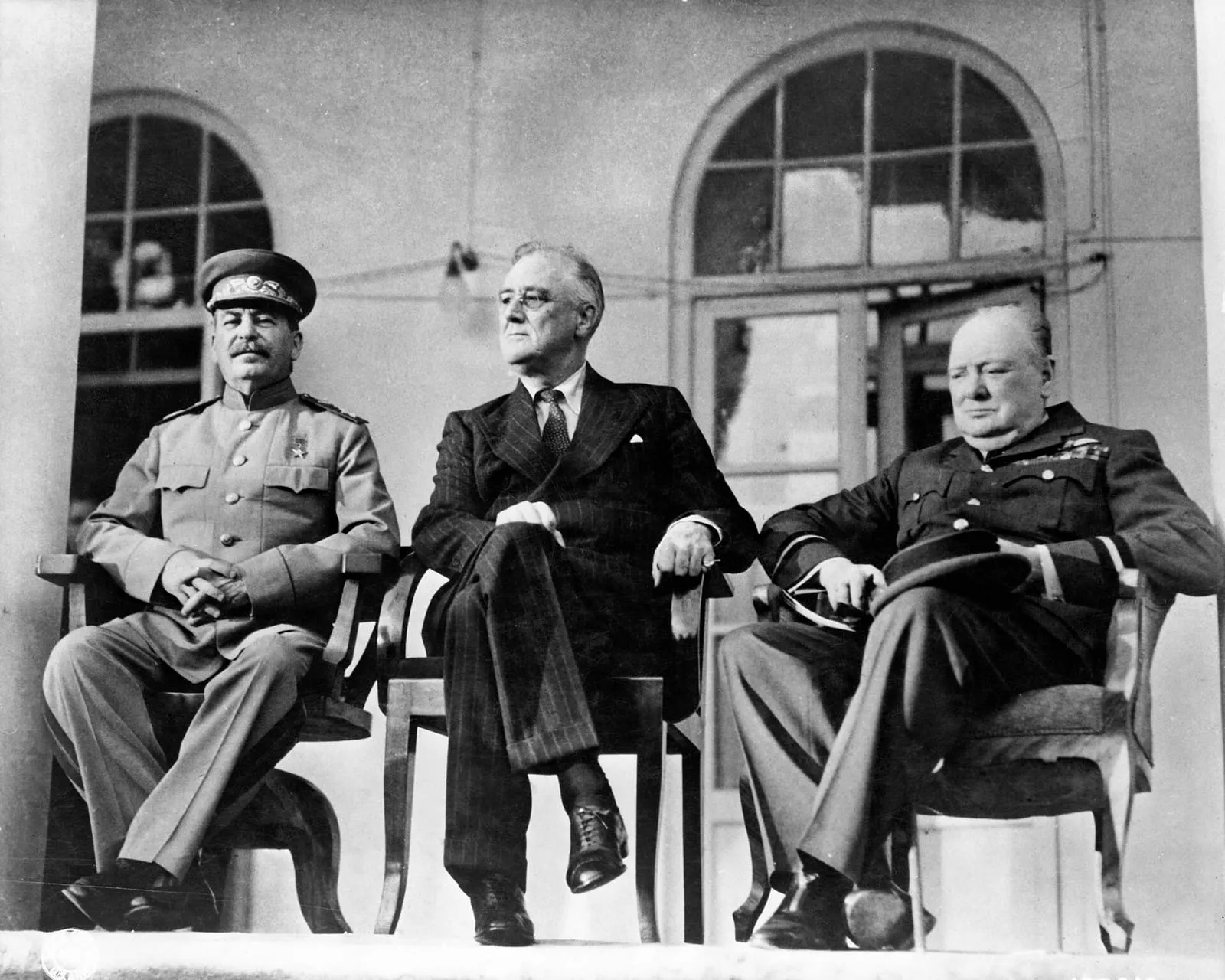 Stalin, Roosevelt and Churchill on the portico of the Soviet Embassy during the Tehran Conference, 28 November 1943.