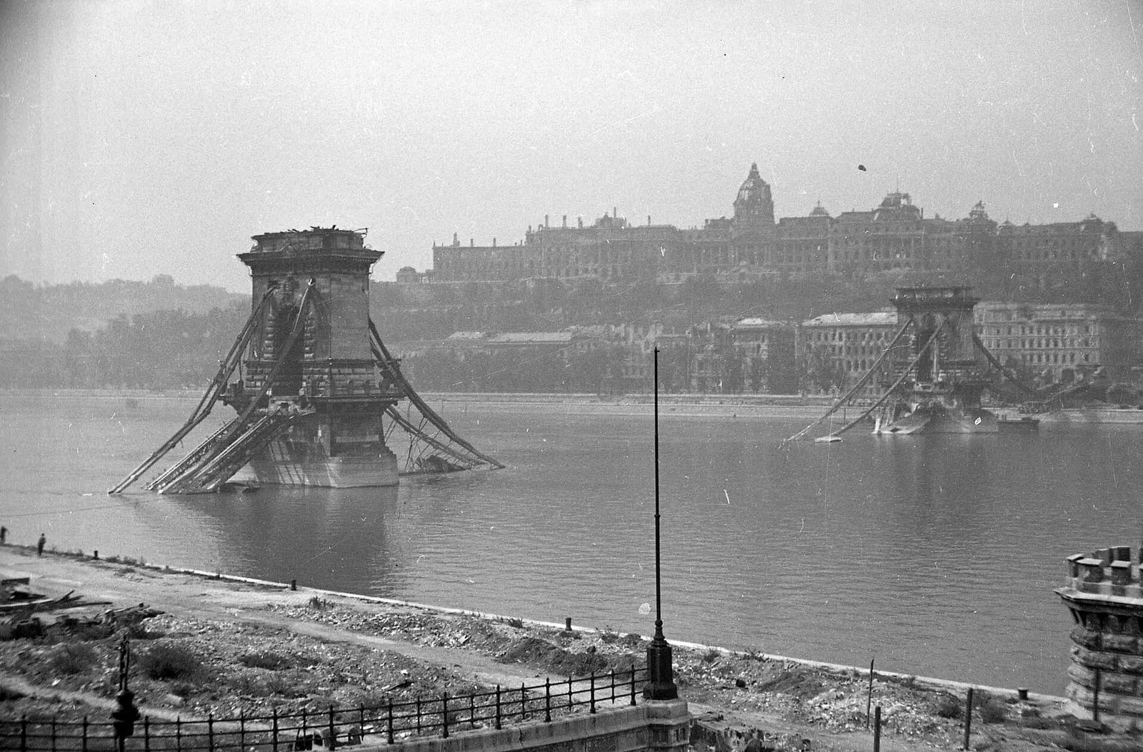 The destroyed Chain Bridge and the ruined Royal Palace in Budapest, 1945.