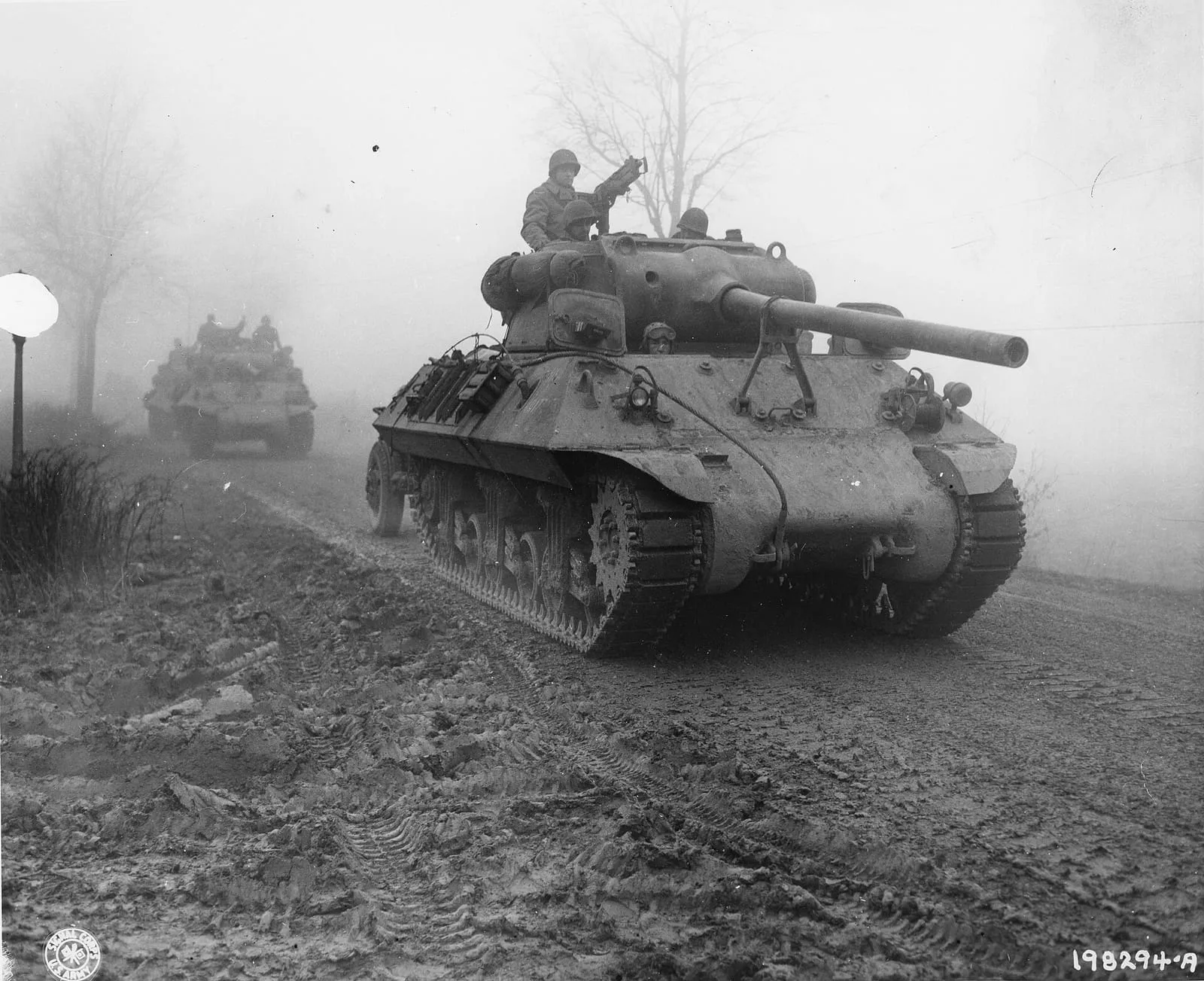 American tank destroyers move forward through heavy fog near Werbomont, Belgium, on 20 December 1944, to check the German spearhead.
