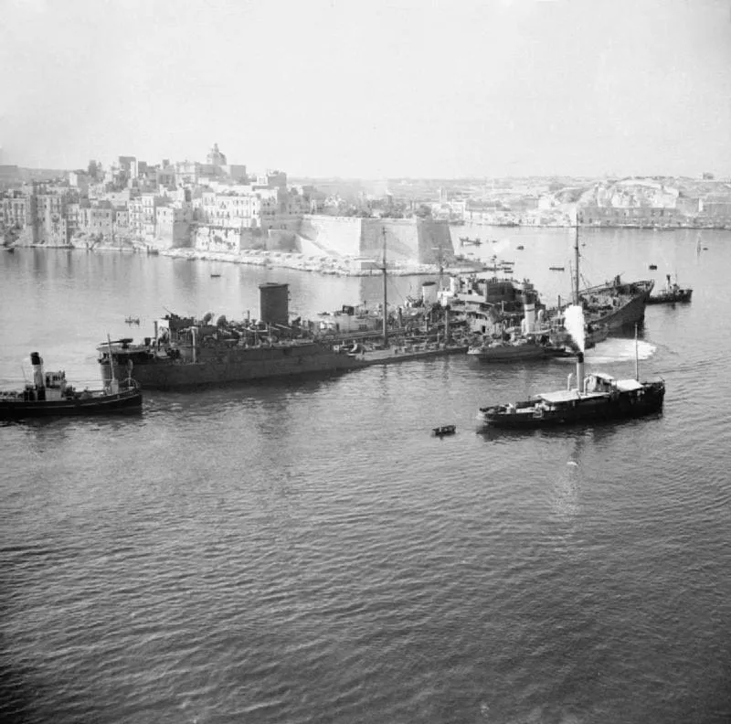 The damaged tanker Ohio, supported by Royal Navy destroyers, approaches Malta on 15 August 1942.