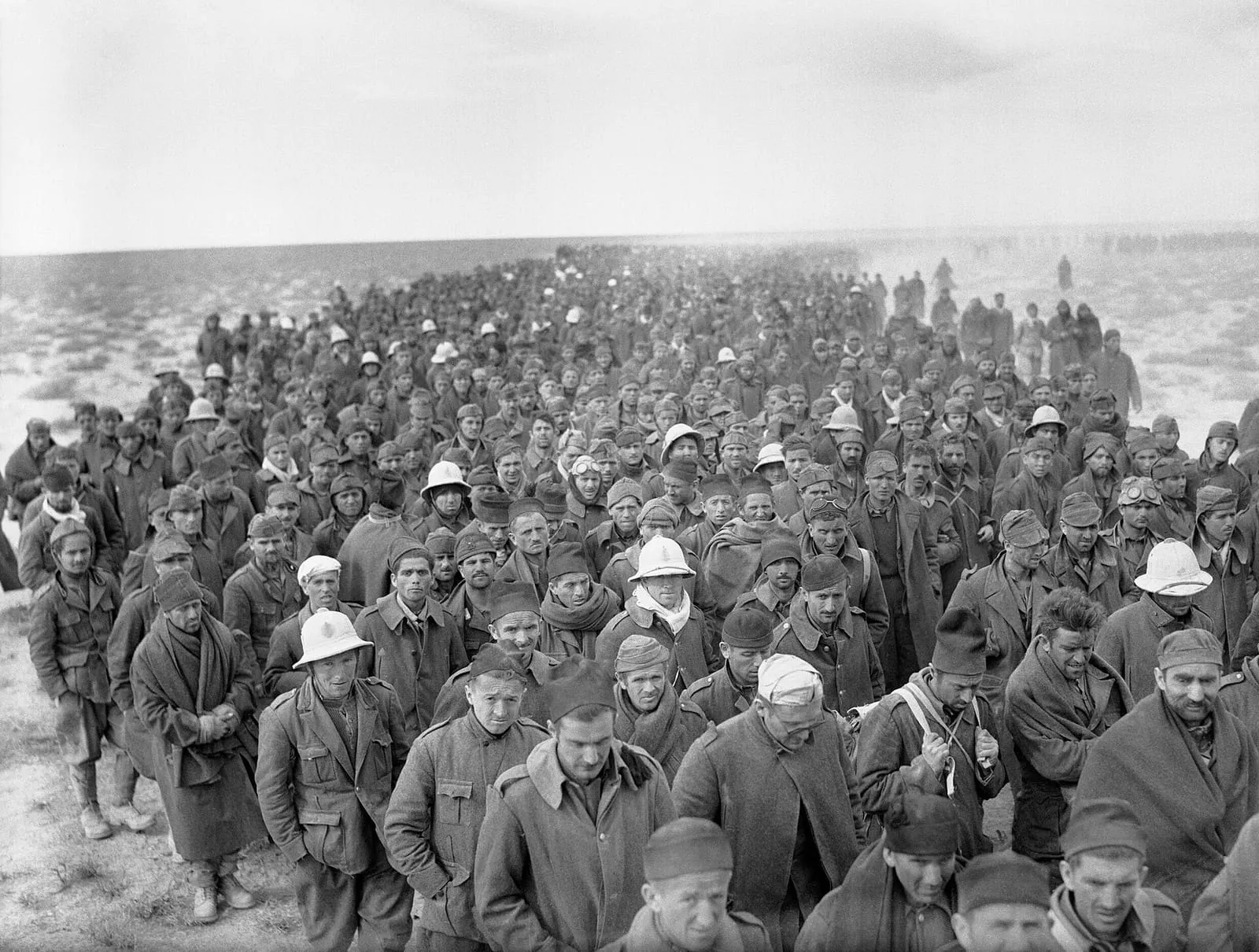 A column of Italian prisoners captured in the assault on Bardia marching to a British base, 6 January 1941.