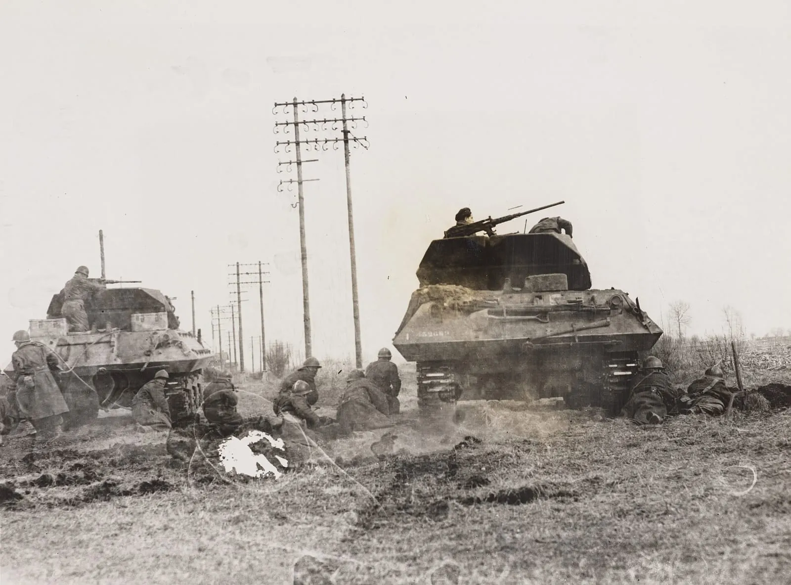 Tanks and soldiers during Operation Nordwind in Alsace–Lorraine, c. 1944–45.