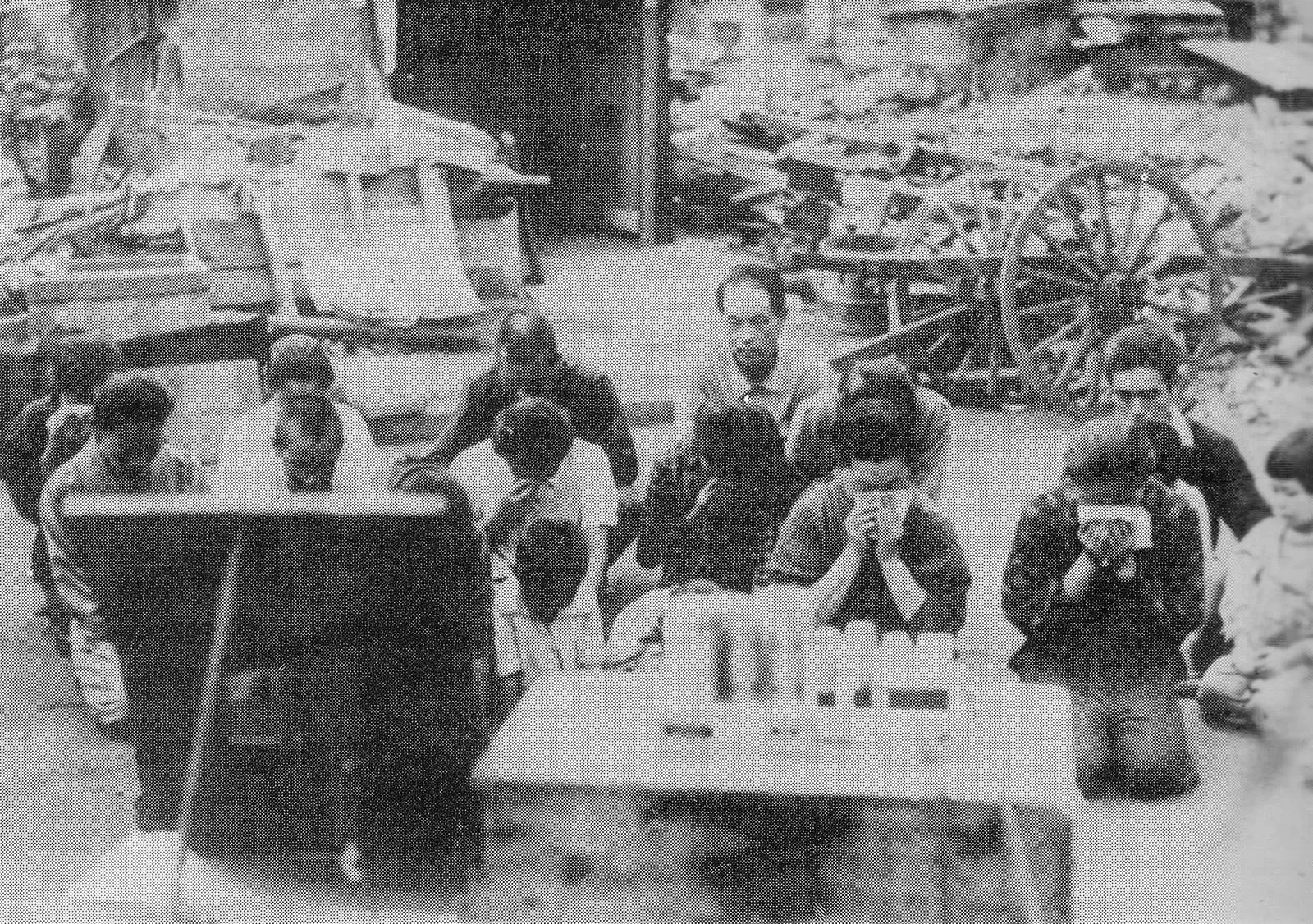 Japanese civilians listen to the Emperor’s surrender broadcast, 15 August 1945.