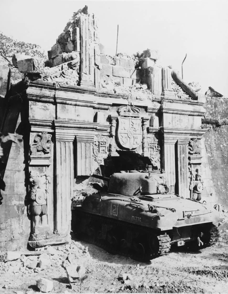 A U.S. Army M4 Sherman tank enters old Fort Santiago in Manila through an enlarged gate, 26 February 1945.