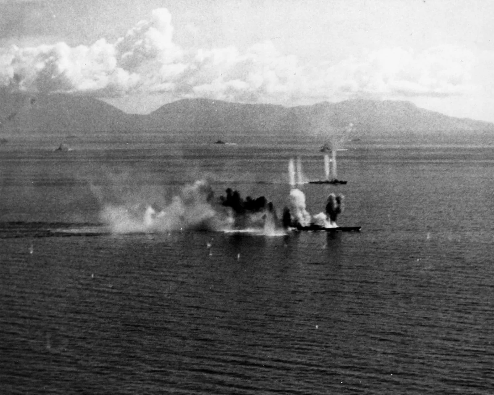 US Navy aircraft attacking the battleship Musashi and a destroyer in the Sibuyan Sea, 24 October 1944.