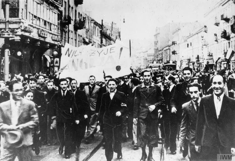 Enthusiastic crowds march through the streets of Warsaw after Britain declared war on Germany, 3 September 1939.