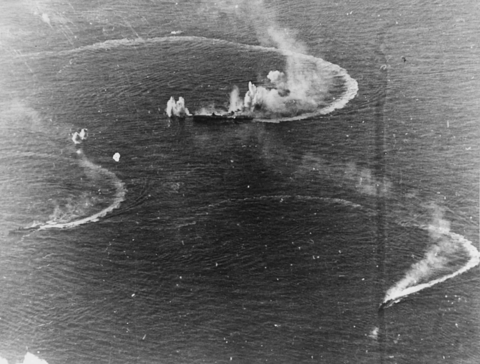 The Japanese carrier Zuikaku and two destroyers under attack by US carrier aircraft, 20 June 1944.