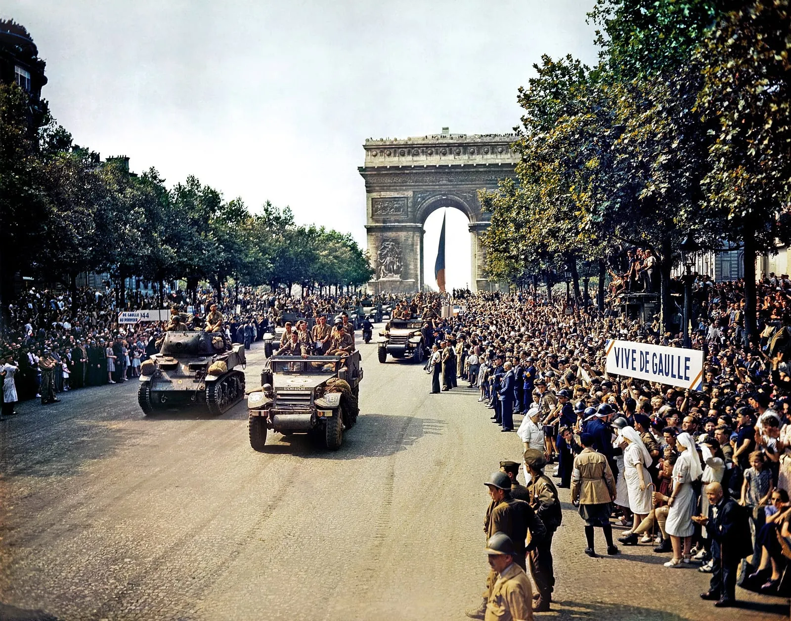 Crowds of Parisians on the Champs-Élysées watching General Leclerc’s 2nd Armoured Division pass, 26 August 1944.