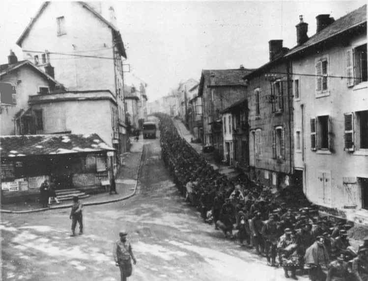 Some of the 5,000 German officers and men captured at Strasbourg marching through Épinal, December 1944.
